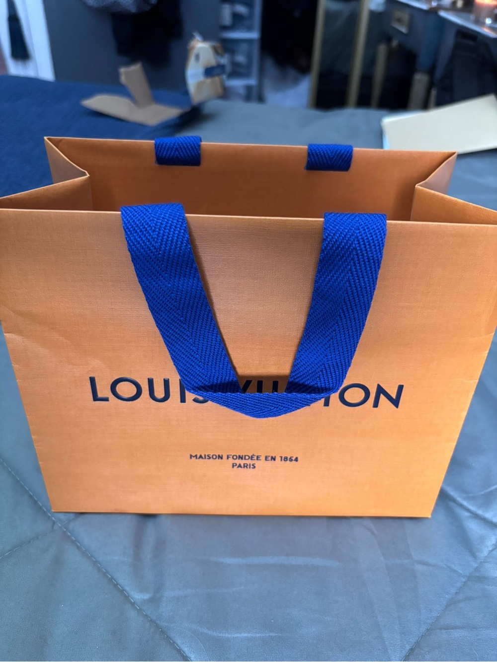 Louis Vuitton Orange Shopping Bag with Blue Handles and Logo